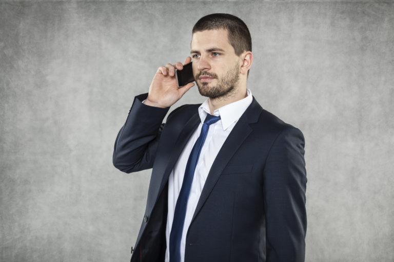 serious businessman talking on the phone