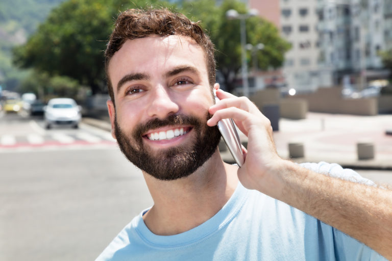 Image of a man using his Brazil virtual phone number.