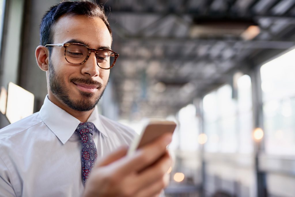 An image of a man using his toll-free Canada phone number.