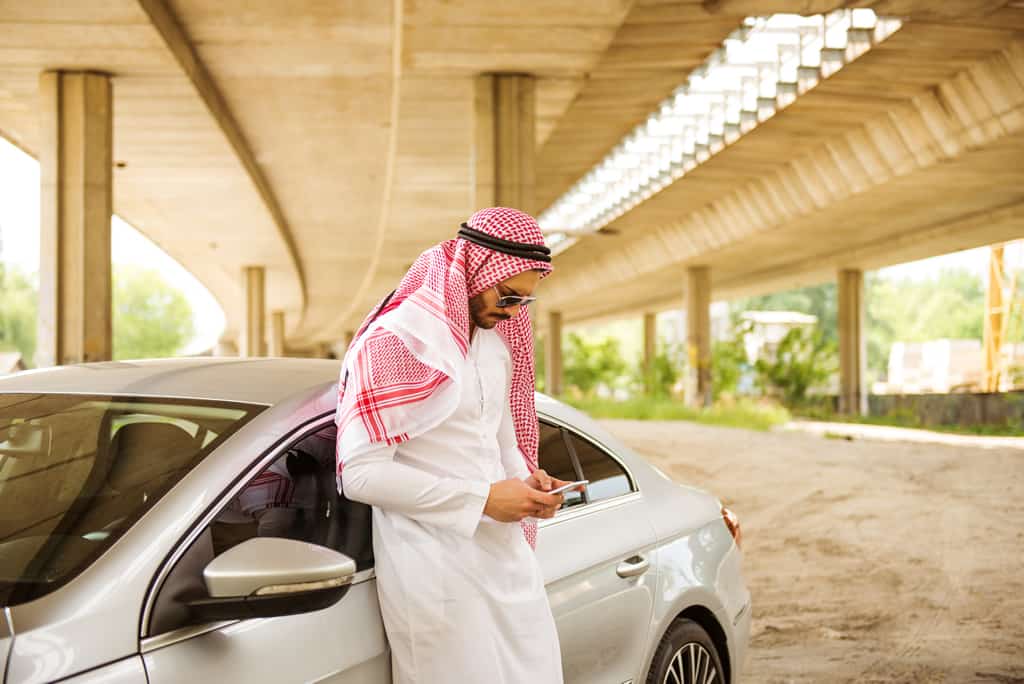 arab man cellphone car