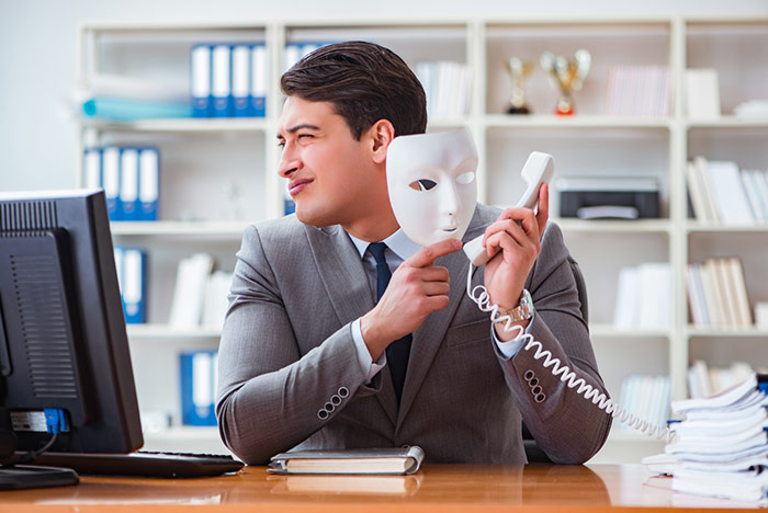 An image of a man ensuring authentication and fraud prevention in call centers.