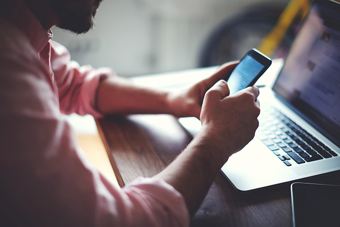 A photo of a man using CTI (Computer Telephony Integration)